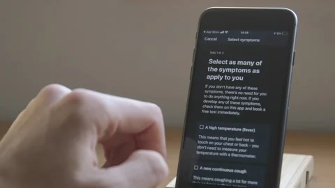 NHS Test and Trace App - Symptom Check Stock-Footage 143482414