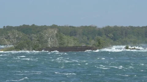 Niagara dam [during solar eclipse] stranded ship Stock Footage 82734537