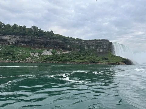 Niagara Falls and Cliffs on a Cloudy Day from Water Level Stock Photos