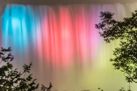 Niagara falls lit up at night in different colors Stock Photos