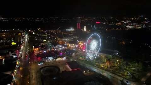 Niagara Falls Ontario Aerial v24 Nighttime panning cityscape view to birdseye Stock Footage 119138053