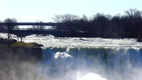Niagara Falls viewed from the Canadian side, with the Rainbow Bridge connec.. Stock Footage 341692321