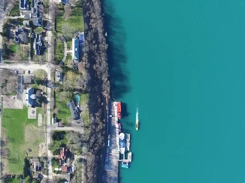 Niagara river sunny day camera look down river port road aerial Stock Footage 70872324