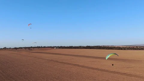 Nice aerial drone shot of powered paragliding enjoying flying in the air Stock-Footage 118284842