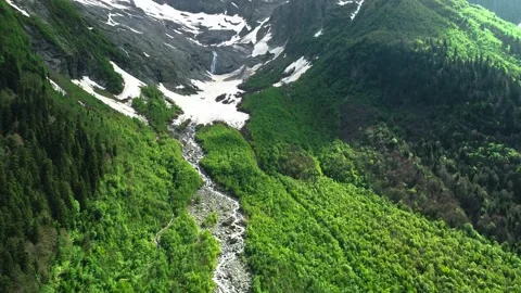 Nice aerial view of the mountain valley and high mountain slopes. Stock Footage 157239954