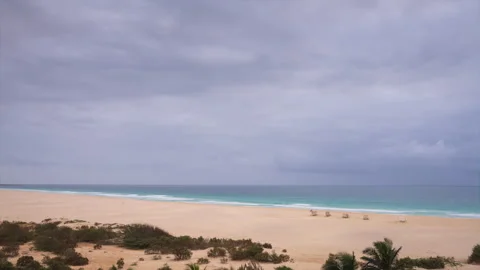 Nice aerial view of sandy beach turquoise ocean and background clouds Stock Footage 325841027