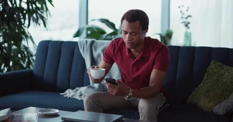 Nice african busy guy staying in cozy apartment during quarantine using Stock Footage 148161401