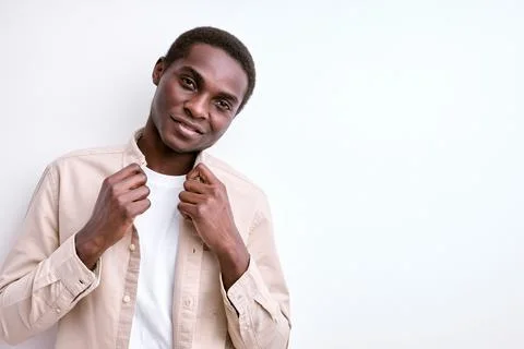 Nice African Man Posing At Camera Holding Collar, Smartening Up Stock Photos
