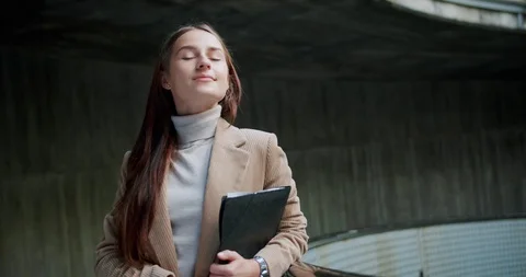 Nice alluring student female with positive feelings and smile looking to camera Stock Footage 120747458