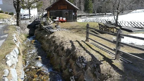 NICE ALPINE HUT WITH STREAM Stock Footage 121450627