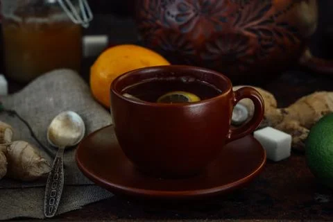 Nice and hot ginger tea with lime and lemon. Stock Photos