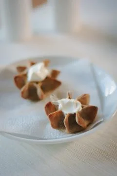 Nice appetizer snacks - tartlets on a white ceramic plate. Stock Photos