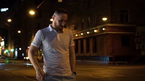 Nice bearded man have a mobile phone call. He answers it and start to chatting Stock Footage 112830680