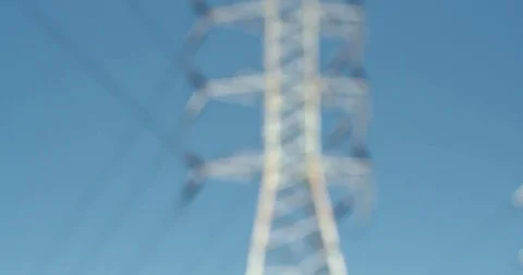 Nice blue sky rack focus to power lines high voltage Electric utility power line Stock Footage 74673935