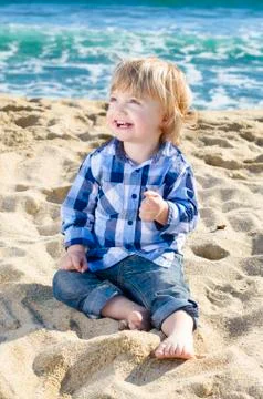 A nice boy on the beach Stock Photos