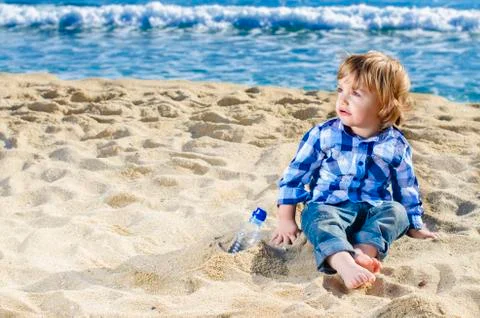A nice boy on the beach Stock Photos