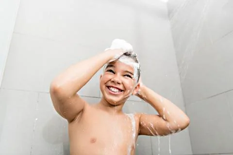 A nice Boy on the shower having fun 스톡 사진