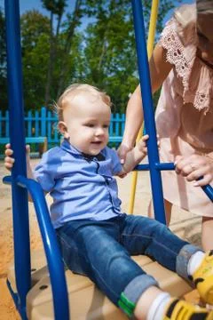 Nice boy on swing Stock Photos