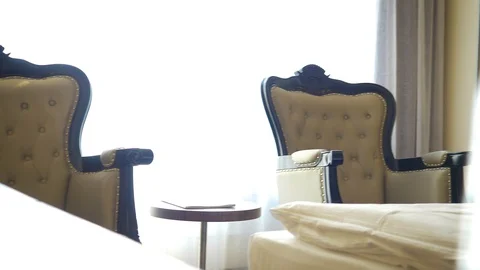 Nice bright hotel room interior with large bed Stock-Footage 107381434