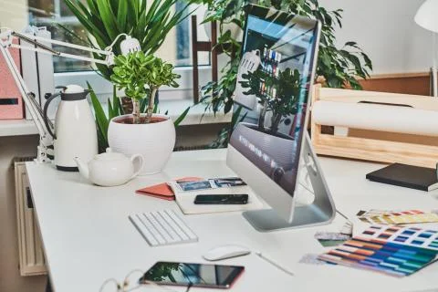 Nice bright office with computer on the table Stock Photos