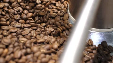 Nice camera movement reveals coffee beans in the roasting machine Stock Footage 168994445