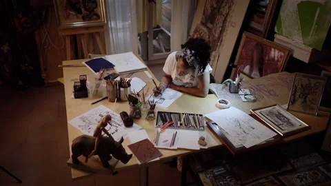 Nice camera movement from top to bottom. Young artist drawing portrait of man Stock Footage 152344741