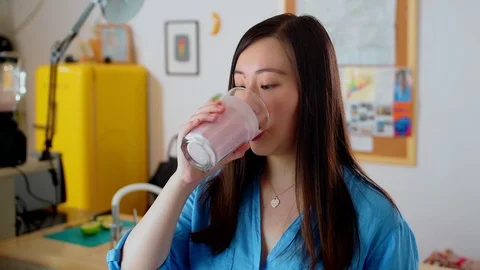 Nice Chinese girl using internet on smartphone surprised of shock content with Stock Footage 114917080