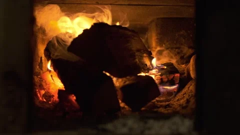 Nice close up view of wooden logs that burn in oven or in fireplace. Heating Video stock 295928669