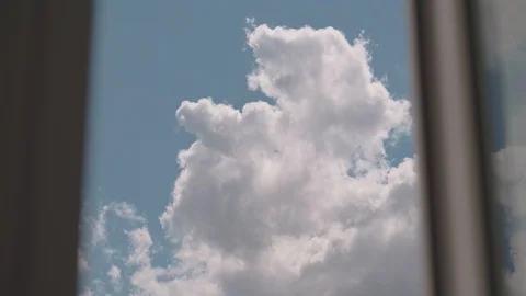 Nice clouds fly in the sky - view from the window Stock Footage 128967994