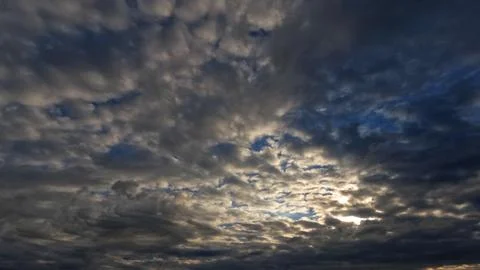 Nice cloudscape of sky with heavy rain or snow clouds bg - photo of nature Stock Photos