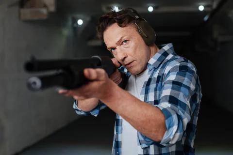 Nice confident man preparing to shoot Foto stock