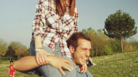 Nice couple having fun in the park Stock Footage 62777182