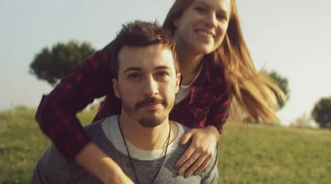 Nice couple having fun in the park Stock Footage 62777202