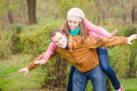 A nice couple playing in the forest Foto stock