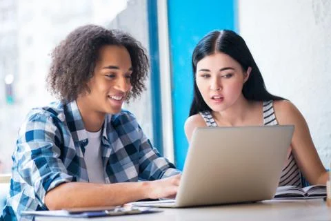Nice couple sitting at the table Stock Photos