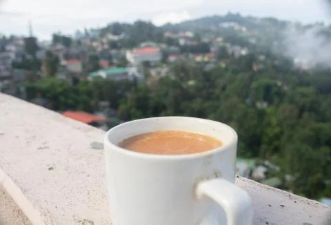 A nice cup of milk tea with a nice natural view in leisure time. Stock Photos