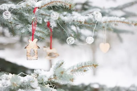 Nice decorations on a Christmas tree with snow outdoors. Celebration, winter  Stock Photos