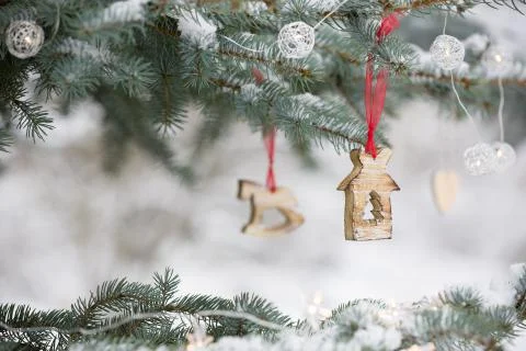 Nice decorations on a Christmas tree with snow outdoors. Celebration, winter  Stock Photos