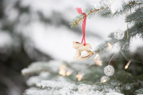 Nice decorations on a Christmas tree with snow outdoors. Celebration, winter  Stock Photos