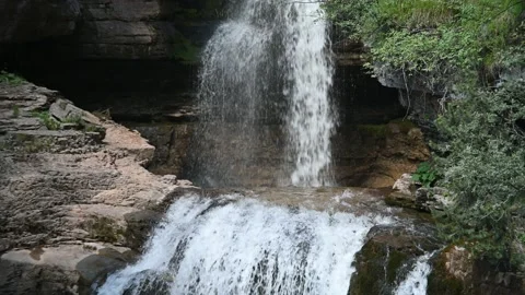 Nice detail of a waterfall (cloudy sky) Stock Footage 219384400