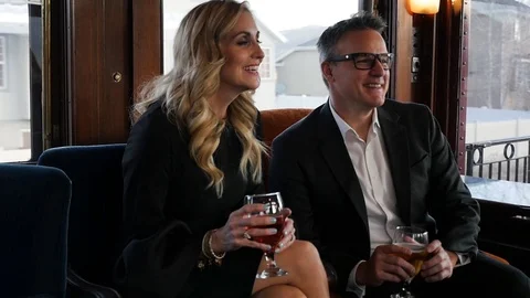 Nice dressed middle aged couple talks to women across room slow motion 스톡 동영상 105652014