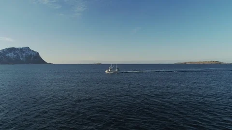 Nice drone shot flying over a small fishing boat at sea Stock Footage 114491078