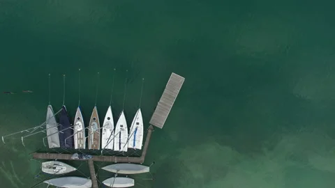 A nice drone shot of many small sail boats on anchorage in the lake Stock Footage 150028513