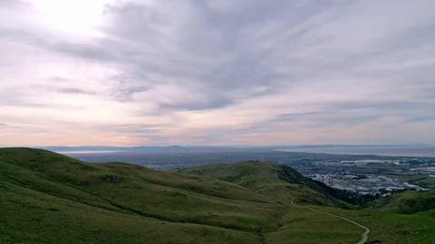 A nice drone shot pulling back at Bowendale Park, with the city of Christchurch Stock Footage 345338955