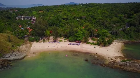 Nice exotic tropical beach panorama, small sand area between rocks, aerial shot Stock Footage