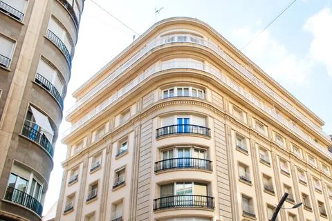 Nice facade of old design building in the main avenue of the city Stock Photos
