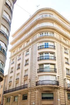 Nice facade of old design building in the main avenue of the city Stock Photos