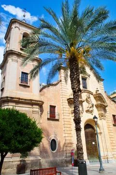 Nice facade with tower and bell tower of the church of Santa Eulalia in Murcia Stock Photos