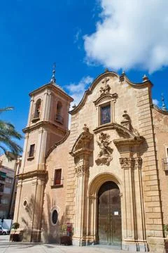 Nice facade with tower and bell tower of the church of Santa Eulalia in Murcia Stock Photos