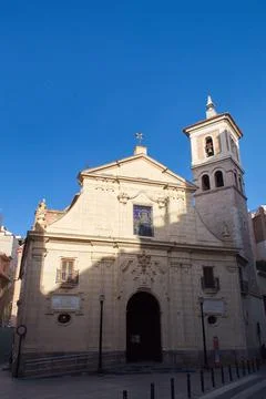 Nice facade with tower and bell tower of the church of Saint Peter in Murcia Stock Photos